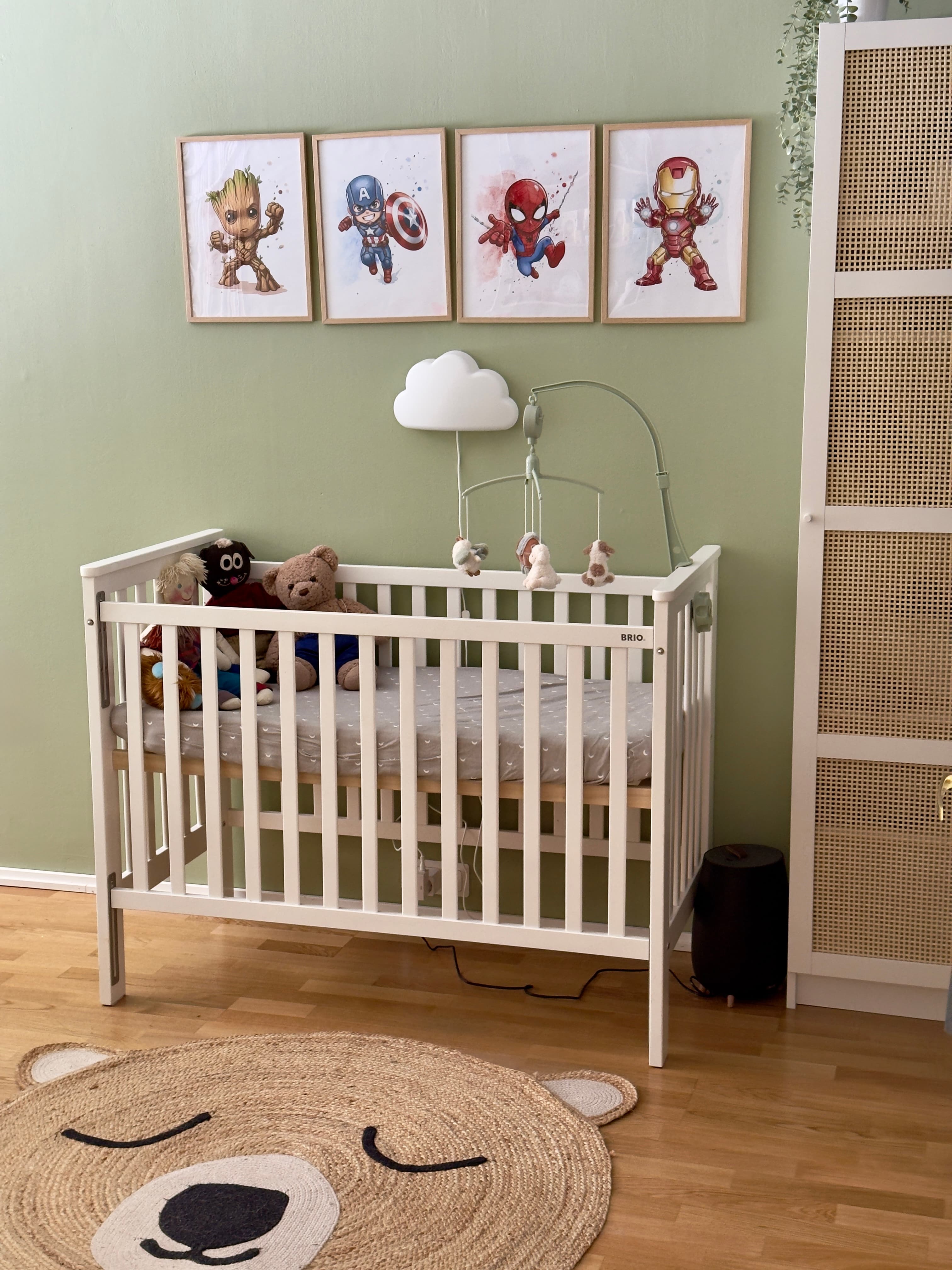 A superhero-themed baby crib setup
